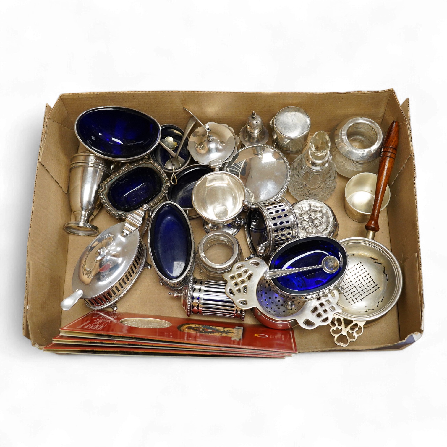 A George V pierced silver three piece condiment set, James Dixon & Sons, Sheffield, 1923/25, together with seven other assorted silver condiments, a silver mounted trinket box, a silver egg cup, a silver mounted glass sa